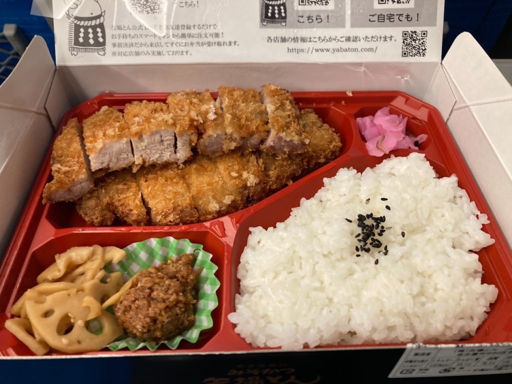 And trust me—after one bite of that salty-sweet pork, you will crave a cold beer. Don't forget to grab an Asahi Super Dry at the platform kiosk!
